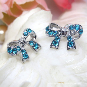 Pendientes de botón de Bowknot de plata con diamantes de imitación azul cielo de aleación de moda